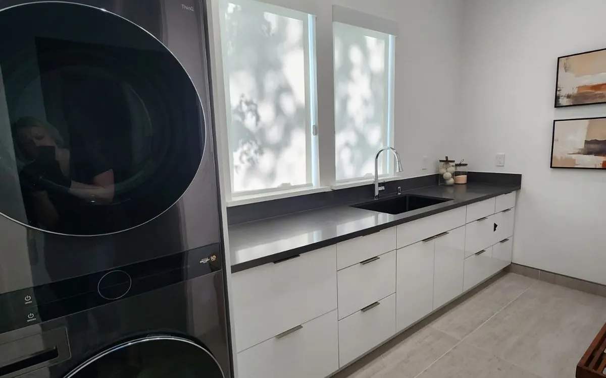 Stacked washer and dryer in a bright laundry room