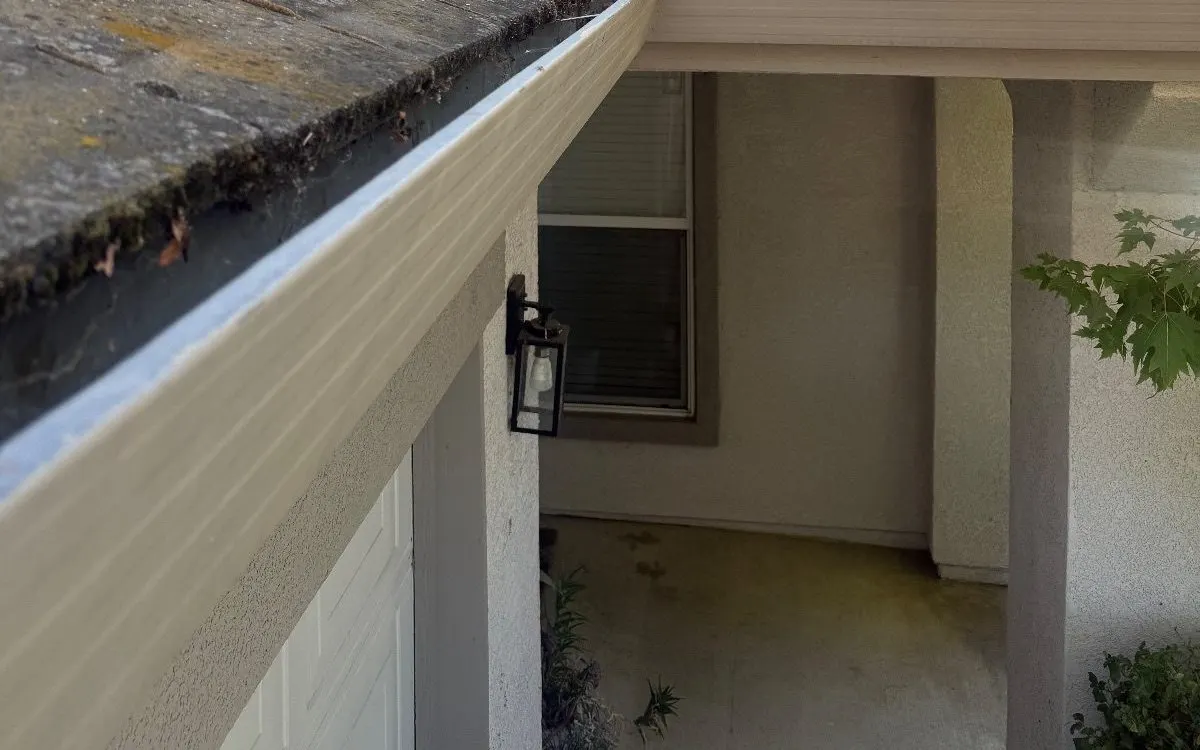Stucco walls, trim and eave around the entry of a Sacramento-area house